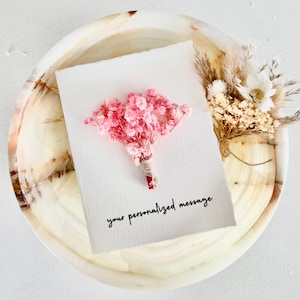 May include: A rustic wooden sign with the text "Welcome to our home" in white lettering. The sign features a distressed finish and a simple, inviting design, perfect for front door decor.