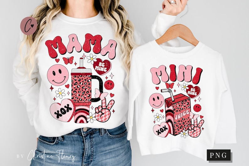 May include: White long-sleeve shirts with a red and pink graphic design. The shirts feature the words "Mama" and "Mini" in a retro font, along with a cartoon juice box, hearts, and other cute designs.
