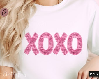 May include: White t-shirt with pink sparkly letters that spell out "XOXO".