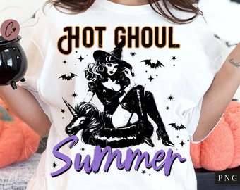 May include: White t-shirt with a black and white illustration of a witch riding a unicorn pool float. The text "Hot Ghoul Summer" is written in purple and orange on the shirt.