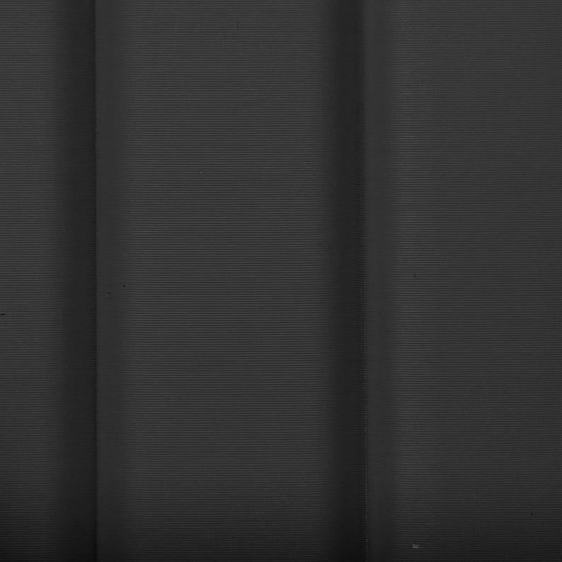 May include: A close-up of a dark grey surface with vertical lines. The lines are thin and evenly spaced, creating a textured appearance. The lighting highlights the subtle variations in the surface.