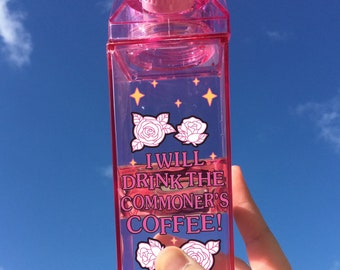 May include: Pink plastic reusable water bottle shaped like a milk carton with the text "I will drink the commoner's coffee!" and a pink rose design.