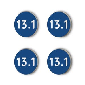 May include: Four blue round stickers with white text that reads "13.1" on each sticker.