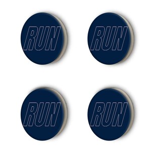 May include: Four round, dark blue buttons with a white outline of the word "RUN" on each.