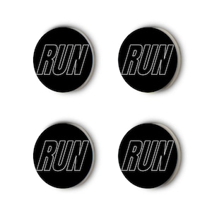 May include: Four black round stickers with the word "RUN" in white outlined text.