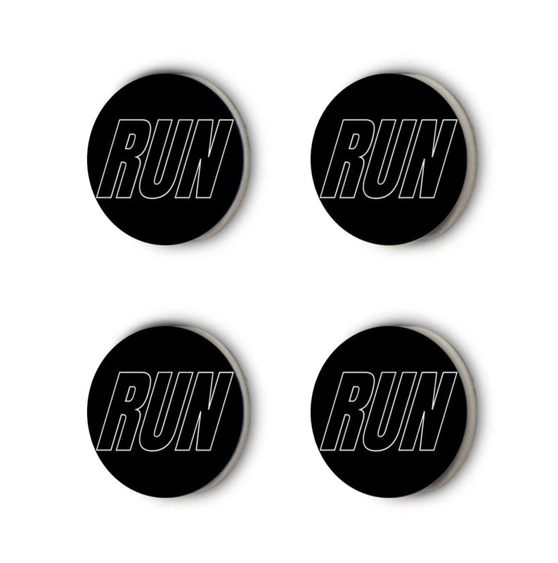 May include: Four black round stickers with the word "RUN" in white outlined text.