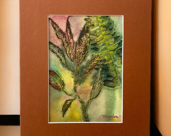 May include: A framed watercolor painting of a plant with green and brown leaves. The artwork is set in a brown mat and frame. The painting has a white border and is signed in the lower right corner.