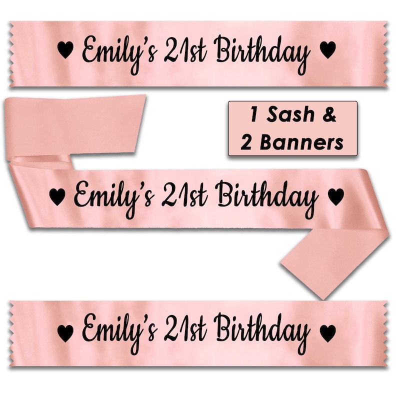 May include: Pink satin sashes with the text "Emily's 21st Birthday" and a heart on each side. The image shows three sashes, one of which is folded in half. The text "1 Sash & 2 Banners" is also included in the image.