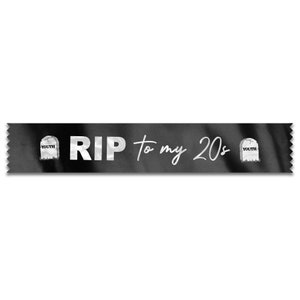 May include: Black and white ribbon with the text "RIP to my 20s" in white. Two small tombstone images with the word "Youth" on them are on either side of the text.