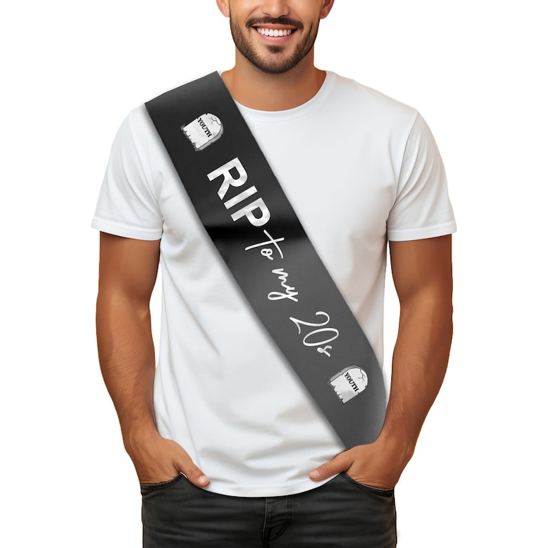 May include: Black satin sash with white text that reads "RIP to my 20s". The sash has two small white tombstone graphics with the word "youth" on them.