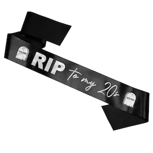 May include: Black satin sash with silver lettering that reads "RIP to my 20s". The sash has two small silver tombstone graphics with the word "Youth" on them.