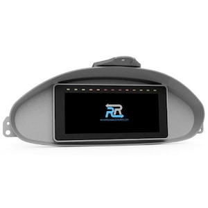 May include: A gray dashboard display with a black screen showing the logo "RR" for "Reverse Racing Works" and a row of colored lights above the screen.