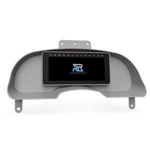May include: A gray dashboard gauge cluster with a black digital display screen. The screen shows a logo and the website address REVERSERACEWORKS.COM. The cluster has mounting tabs and a row of indicator lights.
