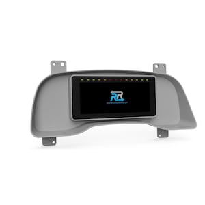 May include: A gray dashboard component with a rectangular screen displaying a logo and text. The screen has a black background with a logo in the center and a series of colored lights at the top. The text "REVERGANCEWORKS.COM" is visible below the logo.