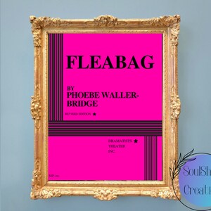 May include: A framed print of a pink playbill for the play "Fleabag" by Phoebe Waller-Bridge. The playbill is in a gold frame and has black and white stripes on the sides. The text "Revised Edition" is printed in black at the bottom of the playbill.