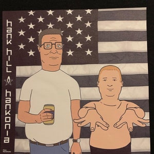 Hank Hill & Bobby “Hankonia” Premium T-Shirt in Mens sizes S-3XL in black or white! Printed on Kirkland brand T-Shirts!