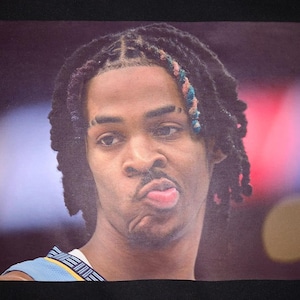 Ja Morant not impressed! Premium T-Shirt in Mens sizes S-3XL in white or black! Printed on Kirkland brand T-Shirts!