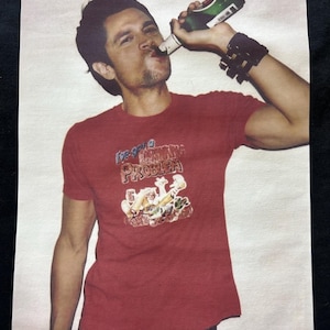Johnny Knoxville chugging a beer Premium T-Shirt in Mens sizes S-3XL in white or black! Printed on Kirkland Brand T-Shirts!