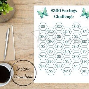 May include: A printable $300 savings challenge with a honeycomb pattern. Each hexagon contains a dollar amount, such as $5, $10, or $20. The printable features two butterflies with teal wings and white dots.