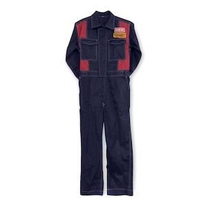 May include: A dark blue work jumpsuit with red and white stripes down the sides. The jumpsuit has a patch on the chest that says "ENEOS" in white letters on a red background. The patch also has Japanese text.