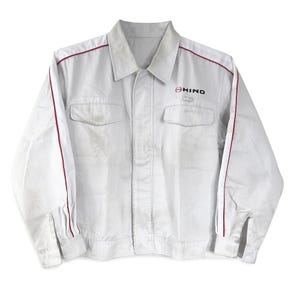 May include: White work jacket with red trim and the HINO logo on the chest.