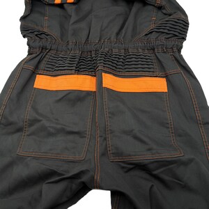 Very rare straight from Japan JDM TOYOTA トヨタ Corporate Tecno mechanic jumpsuit - coverall suite; A true gem for automotive enthusiasts seeking a unique piece of automotive history. This tsunagi is unavailable in the States, making it a rare find that sets you apart from the crowd.