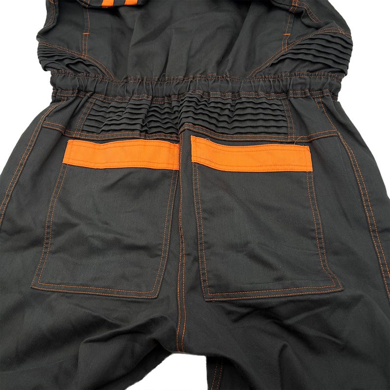 Very rare straight from Japan JDM TOYOTA トヨタ Corporate Tecno mechanic jumpsuit - coverall suite; A true gem for automotive enthusiasts seeking a unique piece of automotive history. This tsunagi is unavailable in the States, making it a rare find that sets you apart from the crowd.