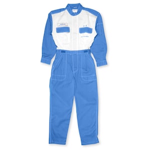May include: A blue and white jumpsuit with long sleeves. The top portion is white with two chest pockets and blue accents. The bottom is blue with pockets and white stitching. The jumpsuit has a button-down collar and a belt.