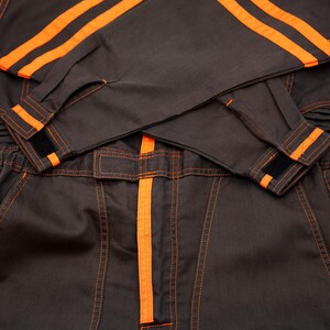 Very rare straight from Japan JDM TOYOTA トヨタ Corporate Tecno mechanic jumpsuit - coverall suite; A true gem for automotive enthusiasts seeking a unique piece of automotive history. This tsunagi is unavailable in the States, making it a rare find that sets you apart from the crowd.