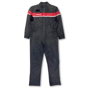 May include: Black workwear jumpsuit with a red and white stripe across the chest and the word "NISSAN" in white lettering.