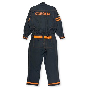 Very rare straight from Japan JDM TOYOTA トヨタ Corporate Tecno mechanic jumpsuit - coverall suite; A true gem for automotive enthusiasts seeking a unique piece of automotive history. This tsunagi is unavailable in the States, making it a rare find that sets you apart from the crowd.