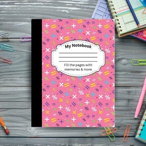 May include: A pink notebook with a black spine and a cover patterned with colorful math symbols. The cover has a white label that reads "My Notebook" and "Fill the pages with memories & more."