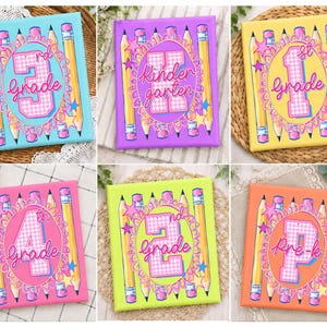 May include: A collection of six square canvas signs featuring school-themed graphics. Each sign displays a grade level, such as 3rd grade, Kindergarten, 1st grade, 4th grade, 2nd grade, and Pre-k, surrounded by yellow pencils, pink stars, and paint pots.