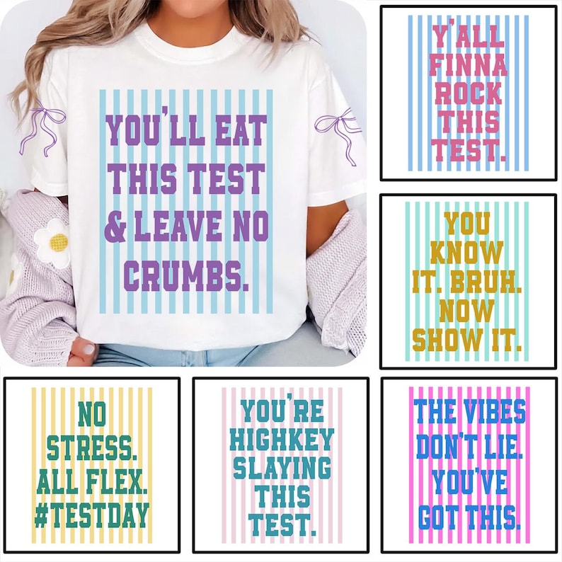 May include: White t-shirt with the text "YOU'LL EAT THIS TEST & LEAVE NO CRUMBS" in purple and blue. The shirt also features vertical blue stripes. Additional images show similar shirts with motivational phrases.