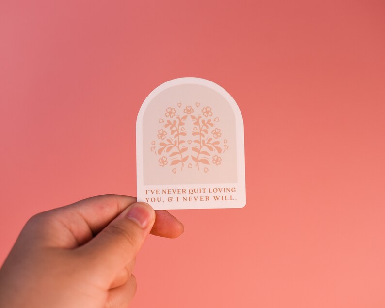 May include: A white sticker with a floral design and the text "I've never quit loving you, & I never will."