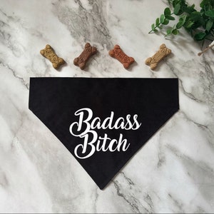 May include: Black dog bandana with white text that says "Badass Bitch".