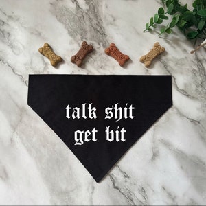 May include: Black dog bandana with white text that reads "talk shit get bit".