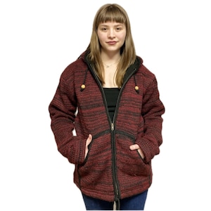 May include: A red and black striped hooded jacket with a full zipper closure. The jacket has two front pockets and wooden toggles on the hood. The jacket is made of a thick, textured material.