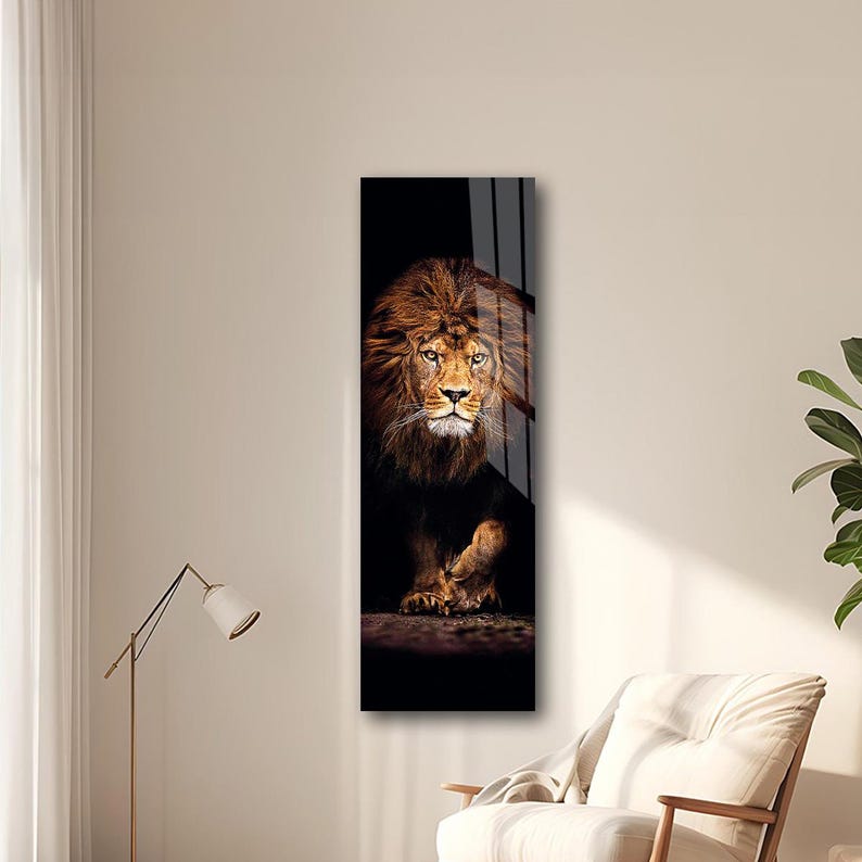 May include: A vertical rectangular wall art print featuring a majestic lion. The lion has a golden mane and piercing eyes, set against a dark background. The artwork is framed and appears to be made of glass or a similar reflective material.