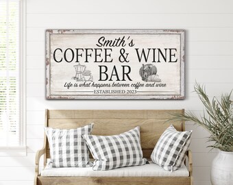 May include: A white wooden sign with black text that reads "Smith's Coffee & Wine Bar" with the tagline "Life is what happens between coffee and wine" and the date "Established 2023".