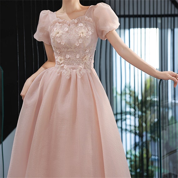 light pink ball gown with sleeves