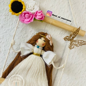 Macramé doll in a swing