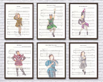 May include: Six framed prints of sheet music with illustrations of women in various costumes. The titles of the songs are "Don't Lose Ur Head", "No Way", "All You Wanna Do", "Get Down", "I Don't Need Your Love", and "Heart of Stone".