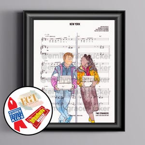 May include: A framed print with sheet music and an illustration of two figures holding boxes. The print is titled "NEW YORK" and includes the text "TWO STRANGERS". The illustration shows a person in a blue and pink jacket and another in a yellow jacket. Broadway logos are also visible.