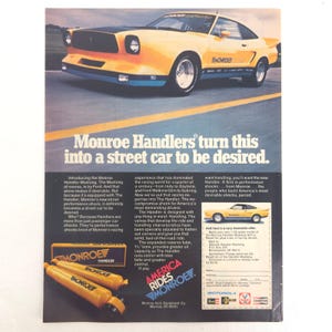 May include: Vintage advertisement featuring a yellow and black Ford Mustang with the text "Monroe Handlers turn this into a street car to be desired." The ad includes images of Monroe Handler shock absorbers.