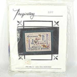 May include: A craft kit in a clear plastic bag. The kit includes a design with the words "Gracious", "True", "Just", "Lovely", "Worthy of Praise", and other words. The kit is labeled "Imaginating" and has the number "897".