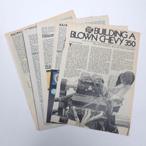 May include: A stack of vintage automotive magazines with articles on engine modifications. The top magazine features the headline "Building a Blown Chevy 350" with a black and white photo of an engine.