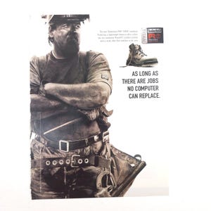 May include: A black and white advertisement featuring a worker in a hard hat and tool belt with the text: The new Timberland PRO TITAN workboot. Featuring a lightweight titanium-alloy safety toe, our exclusive PowerFit comfort system and a work ethic that matches your own. AS LONG AS THERE ARE JOBS NO COMPUTER CAN REPLACE.