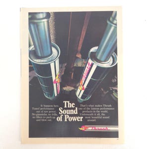 May include: An advertisement featuring two Thrush exhaust mufflers. The mufflers are cylindrical with a black and white stripe and the Thrush logo. The ad includes text: "The Sound of Power."