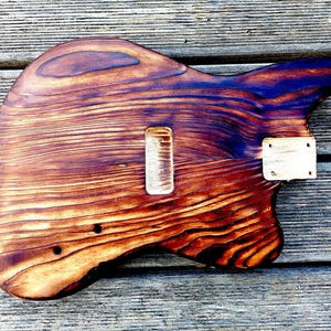 May include: A set of three ceramic mugs with a speckled, matte finish. The mugs are in shades of cream, light gray, and dark gray. Each mug has a simple, minimalist design, perfect for coffee or tea.